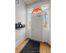 A white door with a black mat in front of it.