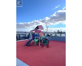A playground with a slide, swings, and a ball pit.
