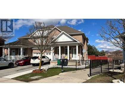 A house with a sign that says "Central 2 Paramount Realty Inc Brokerage".