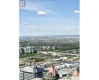 A cityscape with buildings and a clear sky.