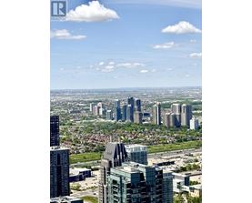 A cityscape with tall buildings and a clear sky.