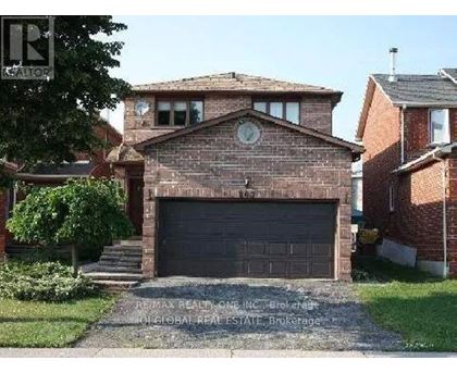 A brick house with a garage door in the front.