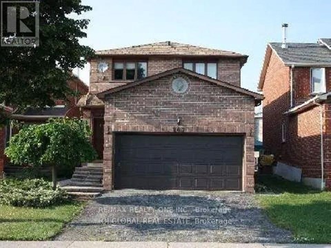 A brick house with a garage door in the front.