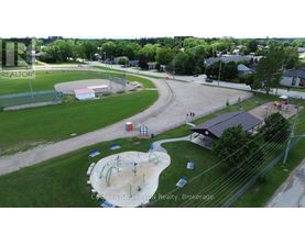 A playground with a slide and a climbing frame.