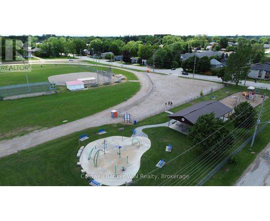 A playground with a slide and a climbing frame.