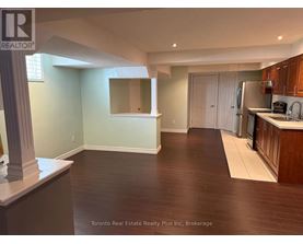 A kitchen area with a counter and cabinets.