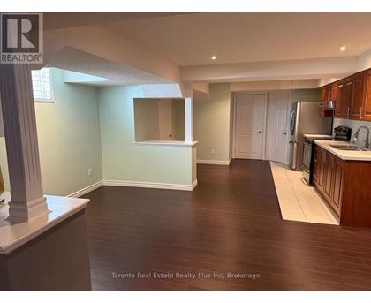 A kitchen area with a counter and cabinets.