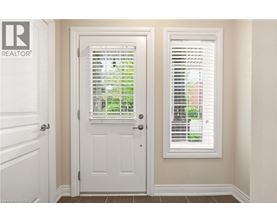 A white door with a window above it.