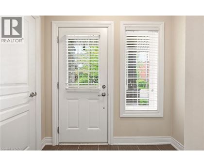 A white door with a window above it.