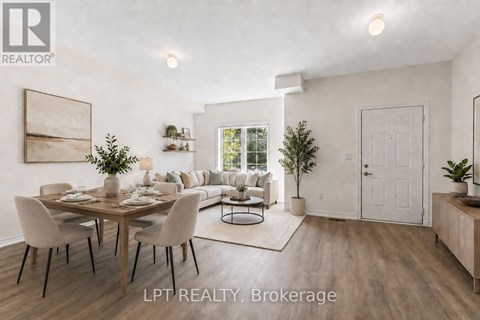 A dining room with a table set for six with a view of a living room in the background.