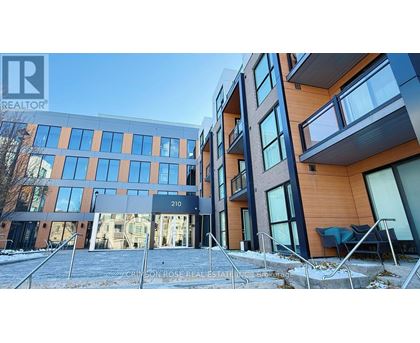A modern building with the number 210 on it.
