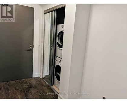 A Royal LePage Signature Realty Brokerage logo is on a door.