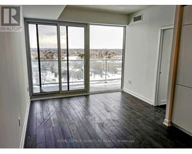 A room with a sliding glass door leading to a snowy landscape.