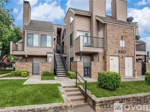 A large house with the number 9817 on the front wall is for sale.