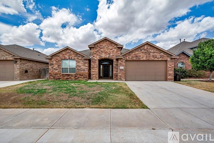 A house with a driveway in front of it.
