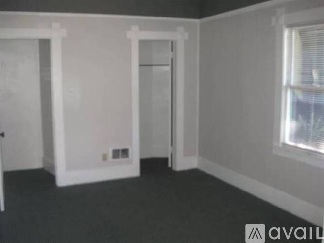 A room with a door and a window.