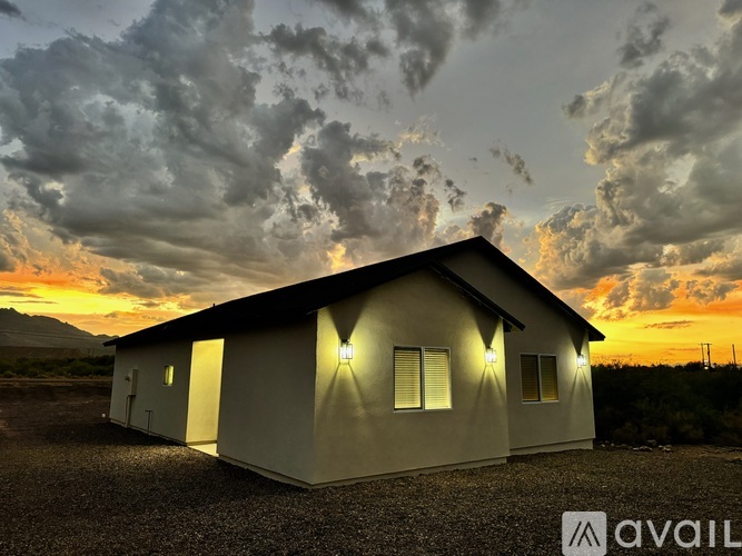A house with a sunset in the background and the word "AVAIL" on the bottom right.