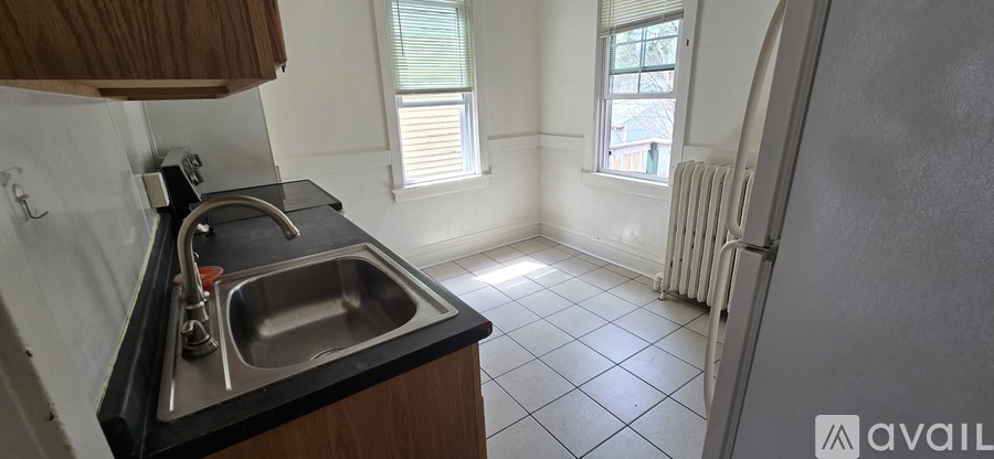 A kitchen with a sink and a window.