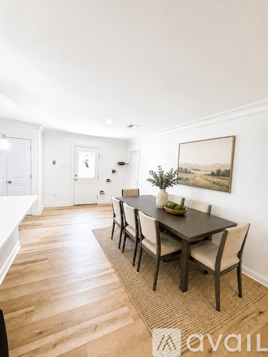 A dining room with a table set for two.