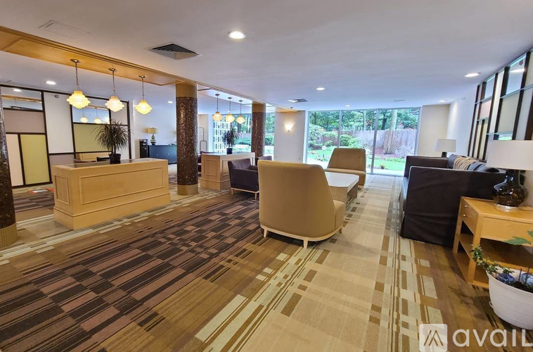 A spacious waiting area with a reception desk and comfortable seating.