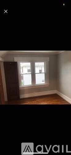 A room with a window and a door.