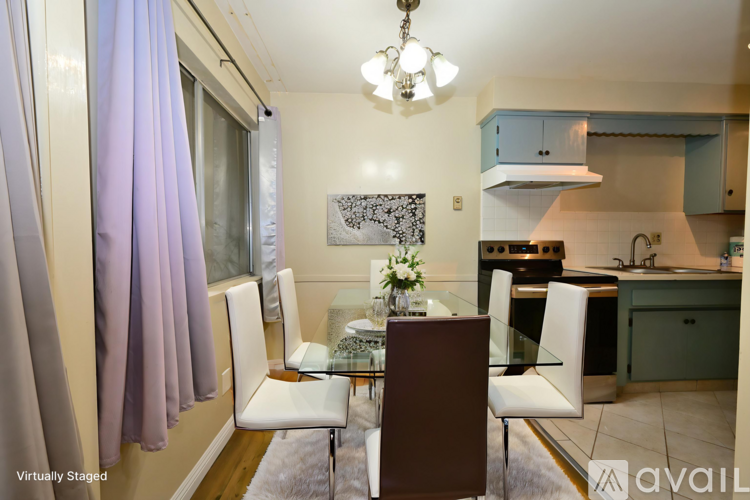 A modern kitchen with a dining table set up.