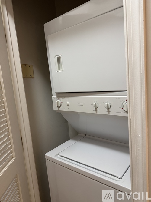 A white dishwasher is installed in a kitchen.