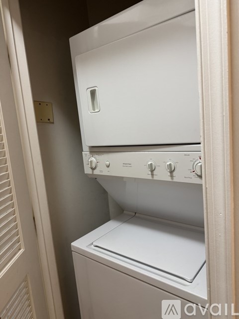 A white dishwasher is installed in a kitchen.