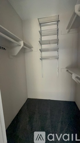 A small room with a metal shelf and a sign that says "available".