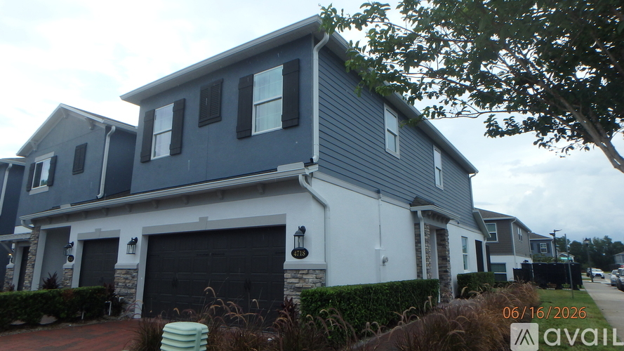 A house with a garage is available for sale.