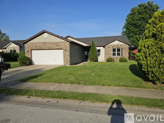A house with a garage is for sale.