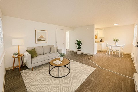 A living room with a grey couch and a coffee table.