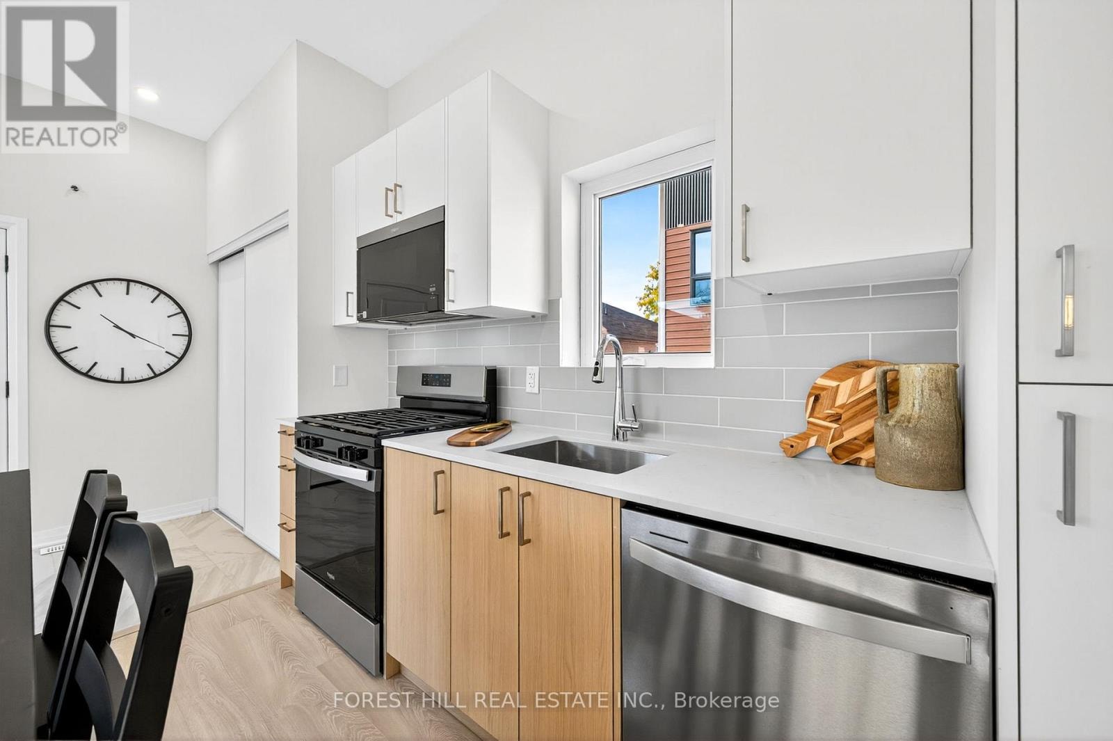 A kitchen with a stove top oven and microwave.