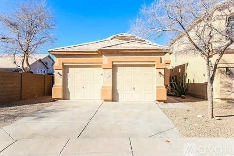 A house with a garage and a driveway.