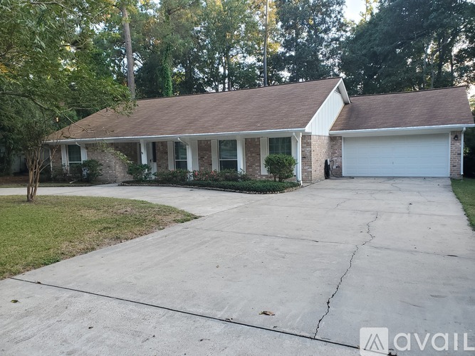 A house with a driveway in front of it.