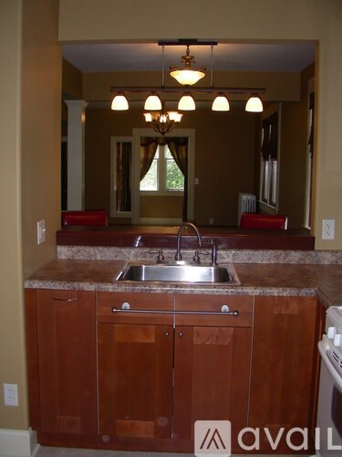 A kitchen with a brown counter and cabinets.