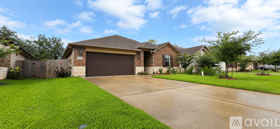 A house with a brown garage door is for sale.