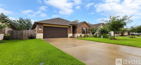 A house with a brown garage door is for sale.