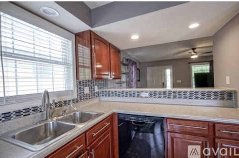 A kitchen with a sink and a window.