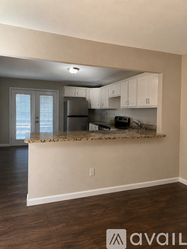 A kitchen with a counter and cabinets.
