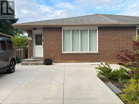 A house with a white door and windows is for sale.