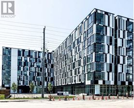 A modern building with a glass facade is shown in the image.