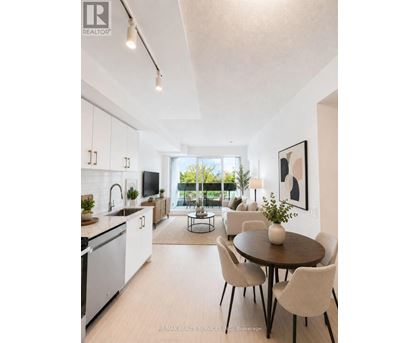 A modern kitchen with a dining table set for four.