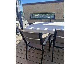 A table and chairs are set up on a patio.