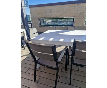 A table and chairs are set up on a patio.