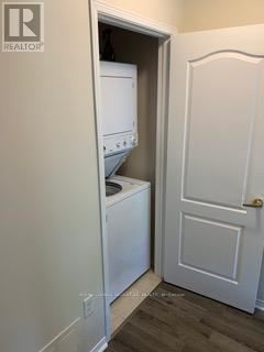 A small laundry room with a washer and dryer.