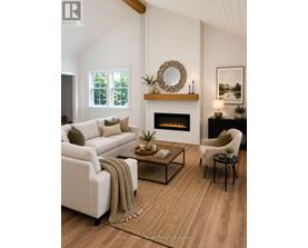 A living room with a fireplace and a white couch.