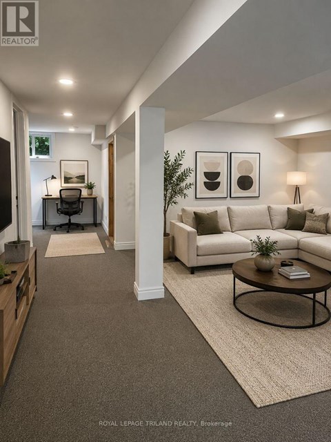 A well-lit, modern living room with a white sofa and a coffee table.
