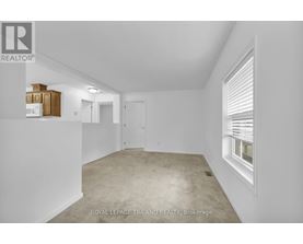 A white room with a window and a door.
