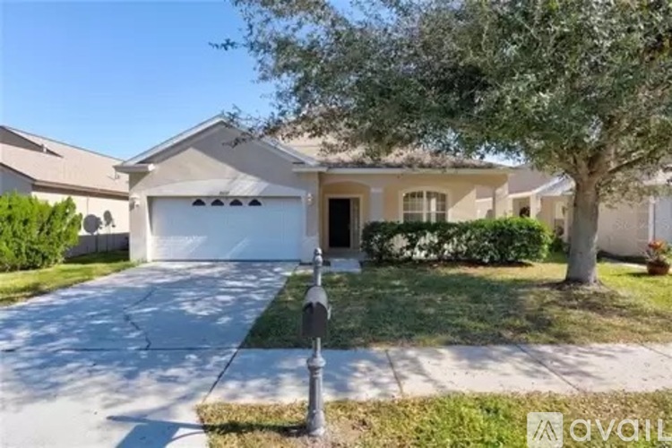 A house with a white garage door is for sale.